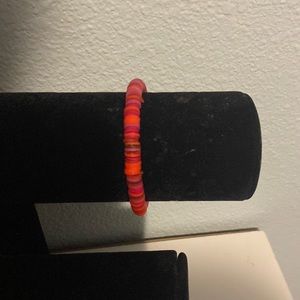 Red homemade bracelet, clay bean